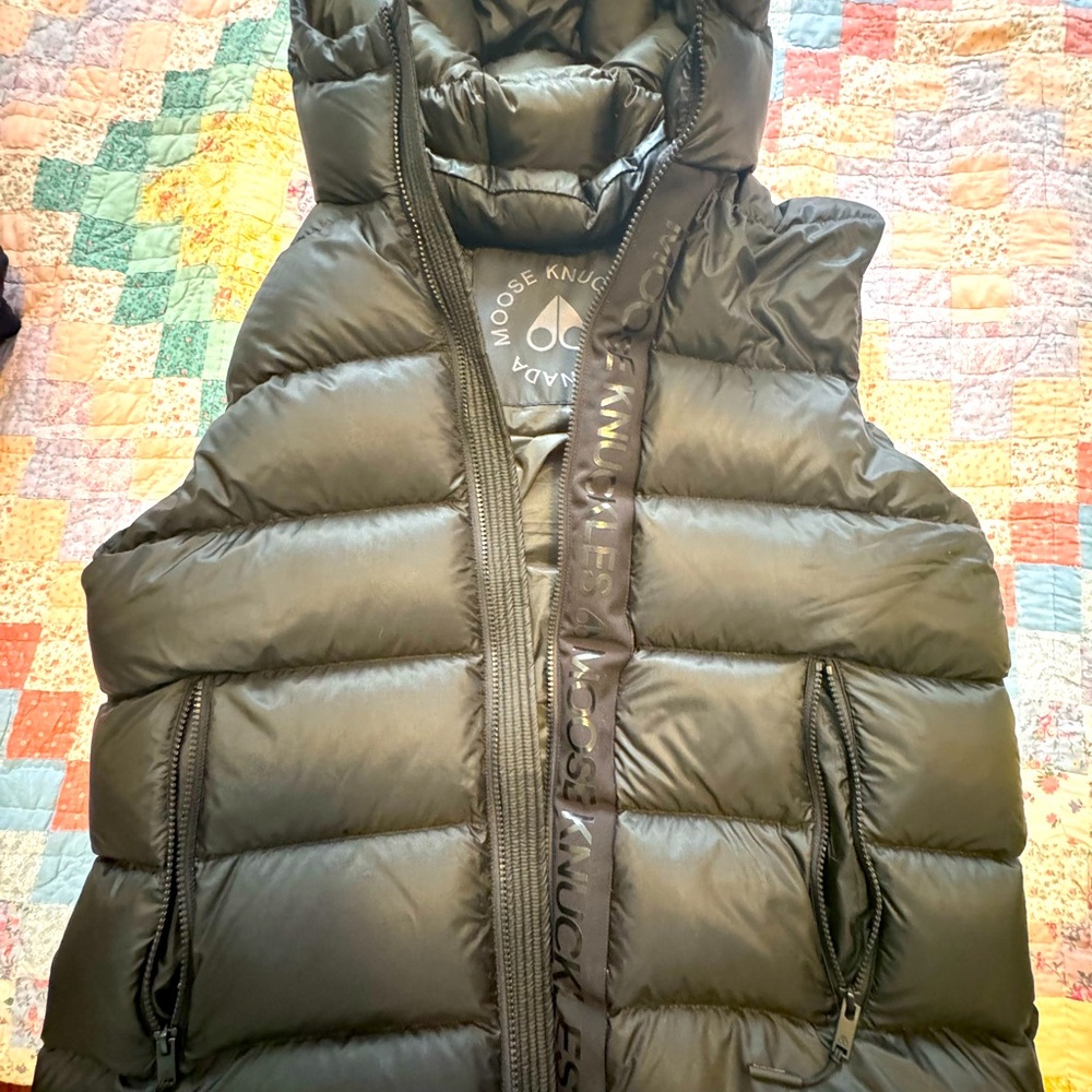 Black moose knuckle hooded vest